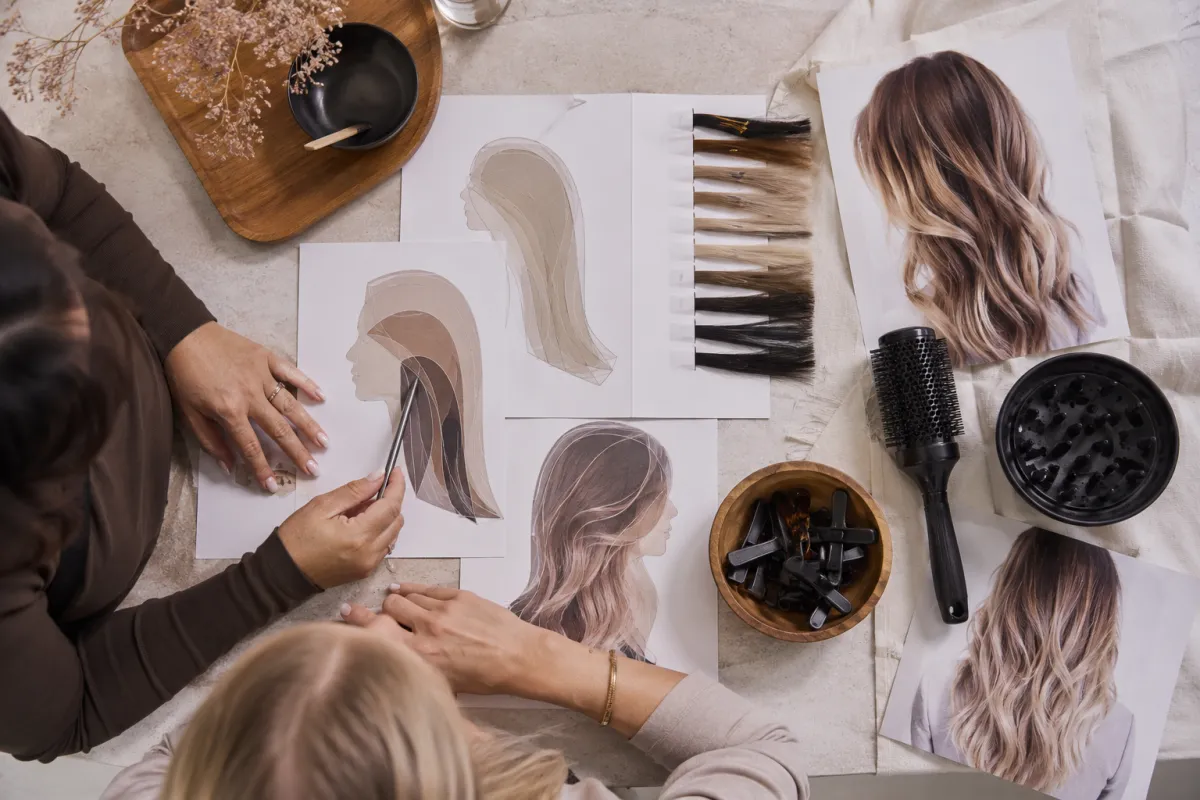 A stylist decision board comparing layer placement, styling tools, and grow-out considerations for wolf and butterfly cuts